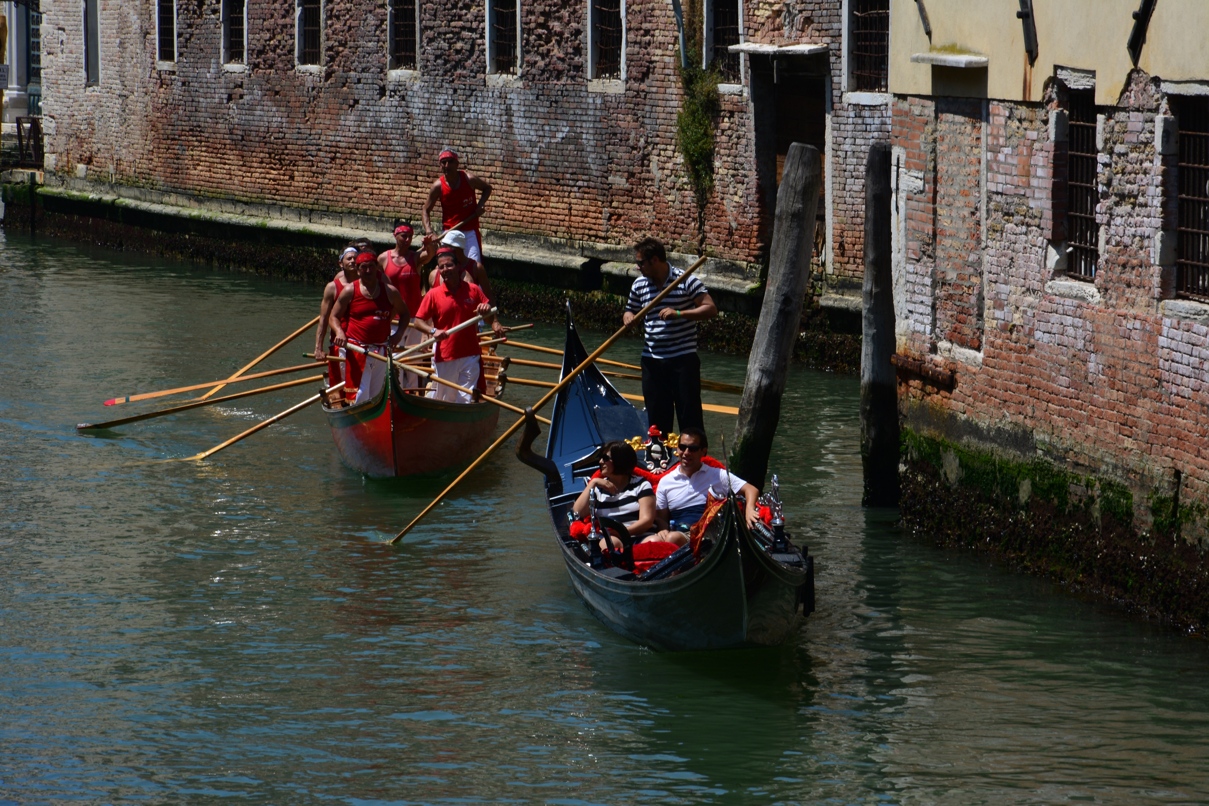 A gondola gliding through a quiet canal in Venice, away from the crowds