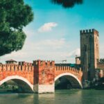 Expert tour guide in Verona leading a private walking tour through the city’s historic center